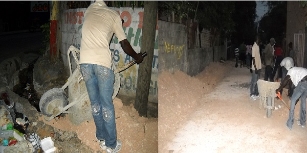 La gráfica muestra el momento en que un equipo de obreros voluntarios y pagados realiza el llenado de la cuneta para ampliar la via que comunica al residencial.