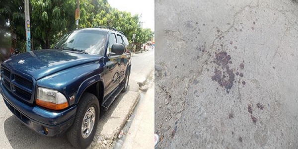 La yipeta de Estarlin y sangre que derramó en la acera cuando fue golpeado.